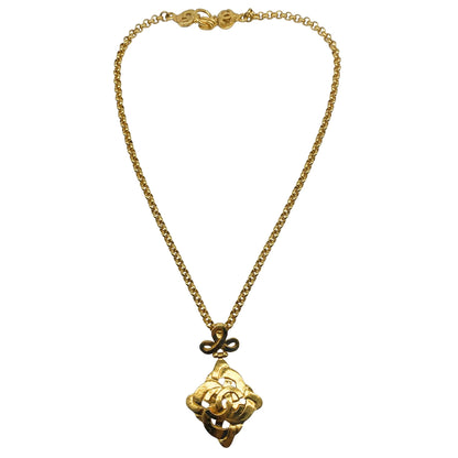 Chanel Gold Tone CC Logo Swirl Cross Necklace