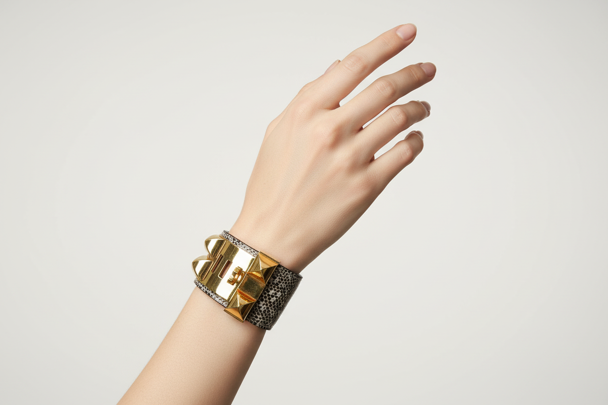 Delicate hand wearing Hermes Lizard CDC Cuff