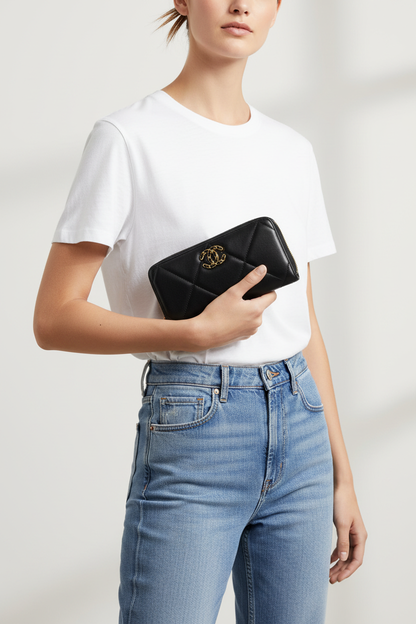 Model holding Chanel 19 Black Zippy Wallet as clutch