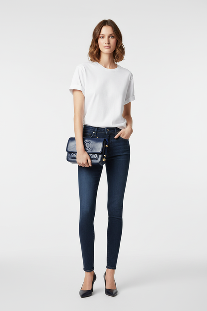 Model holding Chanel Navy En Vogue Flap Bag as clutch