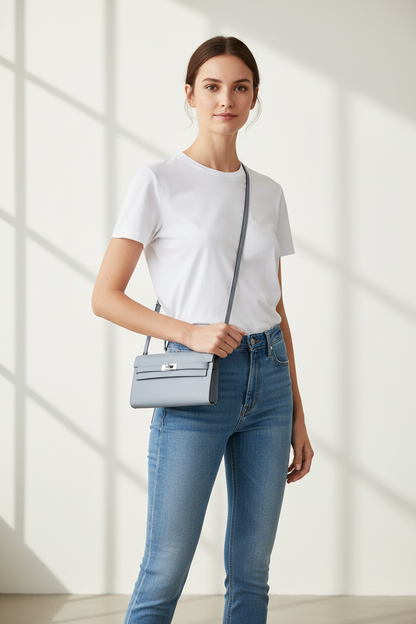Model wearing Hermes Kelly To Go Gris Platin as crossbody