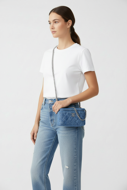 Model wearing smaller Chanel Denim Pearl Crush Vanity as crossbody