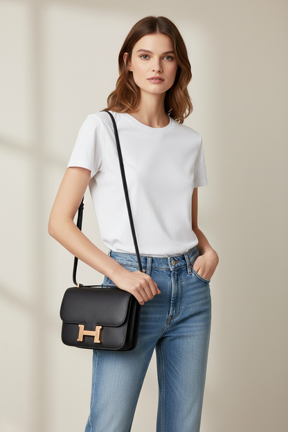 Model with Hermes Constance handbag